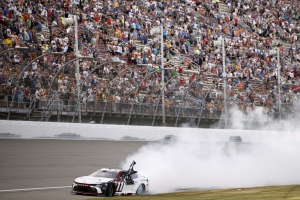 Denny Hamlin celebrates with a burnout after winning the NASCAR Cup Series race at Michigan International Speedway on June 7, 2026, in Brooklyn, Michigan.