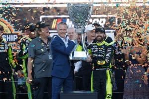 Blaney hoists the Cup Series championship trophy after beating the competition Sunday at Phoenix to earn his first title at the sport&#039;s top level. It was the second year that a Team Penske driver took the title, with Joey Logano doing it in 2022.