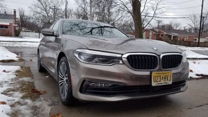 The BMW 530e iPerformance costs the same as the standard 530i sedan, a signal the automaker is wanting more buyers to think green.